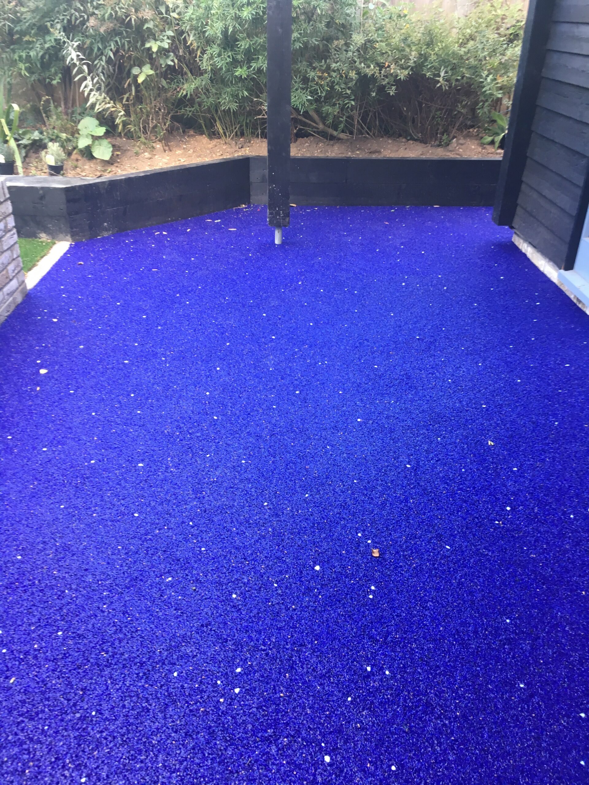 Electric blue, glow in the dark resin bound pathways around the property